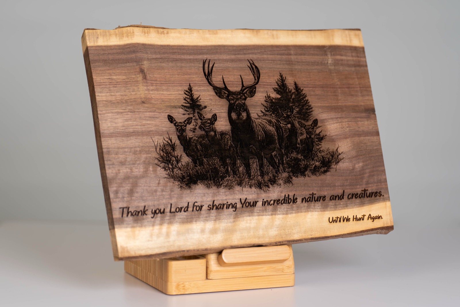 Live-edge walnut slab laser-engraved with a whitetail deer scene and the inscription Thank you Lord for sharing Your incredible nature and creatures.